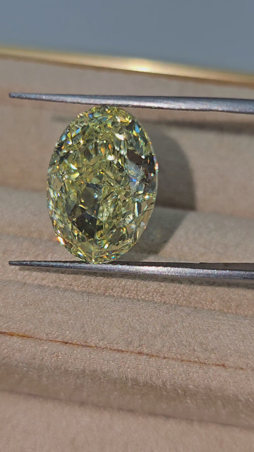 Fancy radiant yellow VS2 oval cut diamond, GIA certified.