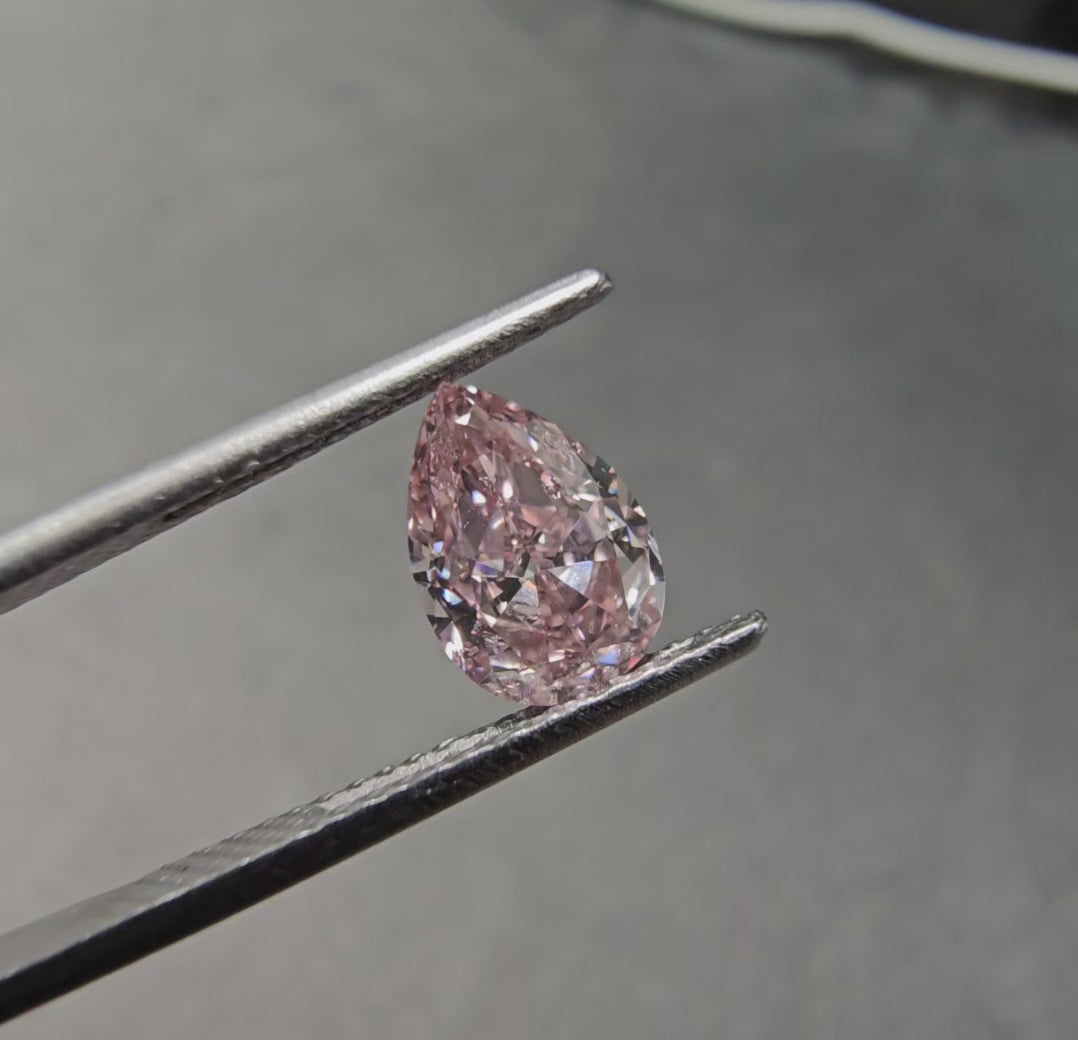 1.02 Carats Total  Fancy Pink  GIA Certified Diamond  Pear Shape Diamond SI2 Clarity  Medium Blue Fluorescence Has the measurements of 1.5 Carat Diamond 