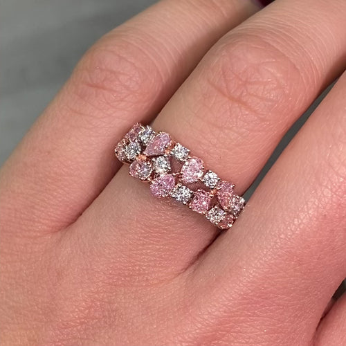 Fine pink and white diamond ring with mixed cuts, offering elegance and a unique design.