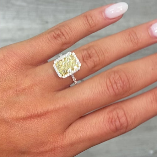 5 Carat Light Yellow elongated radiant cut  in halo diamond ring