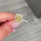 3ct Fancy Yellow Cushion Halo Diamond Ring with a canary yellow diamond