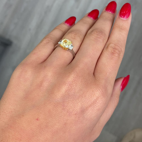 2.28 Carat Center Fancy Light Yellow Cushion Cut Diamond  SI2 Clarity 0.32 Carats of E Color Trapezoids GIA Certified Diamond  Crafted in Platinum and 18k Yellow Gold Handmade in NYC