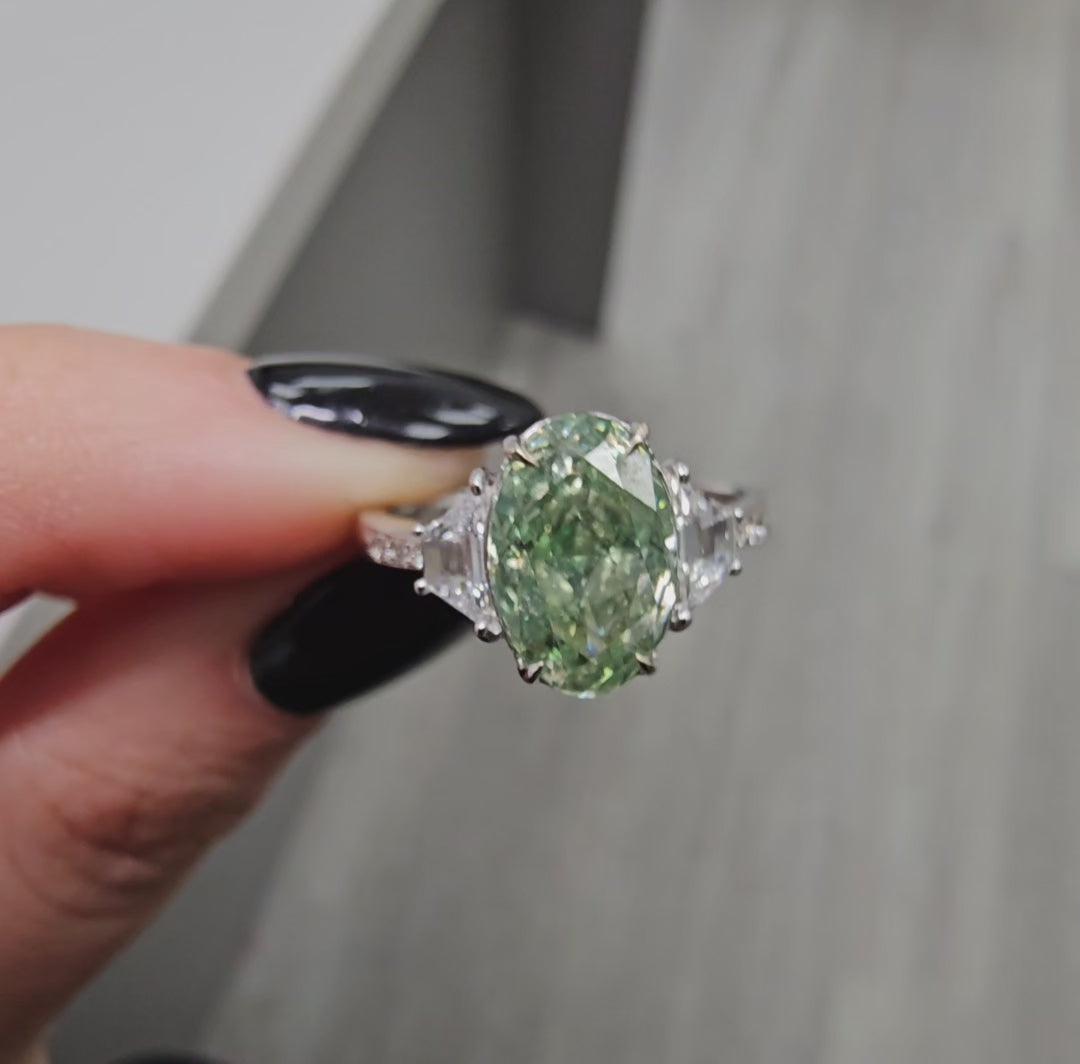 2.00 Carat Oval Diamond GIA Certified Diamond Fancy Grayish Greenish Yellow  Oval Cut Diamond SI1 Clarity  Excellent, Excellent Cutting None Fluorescence 0.31 Carat Side Diamonds  Crafted in 18k White Gold  Handmade in NYC