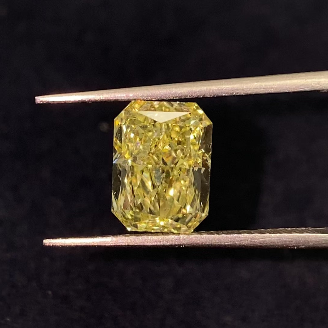 Elongated radiant cut fancy yellow diamond. Long fancy yellow radiant cut.
