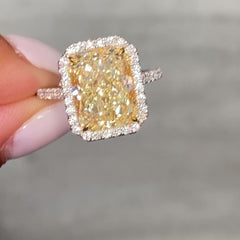 5 Carat Light Yellow elongated radiant cut  in halo diamond ring