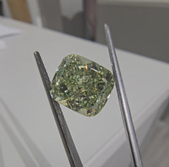 Yellowish green cushion cut diamond, GIA certified.