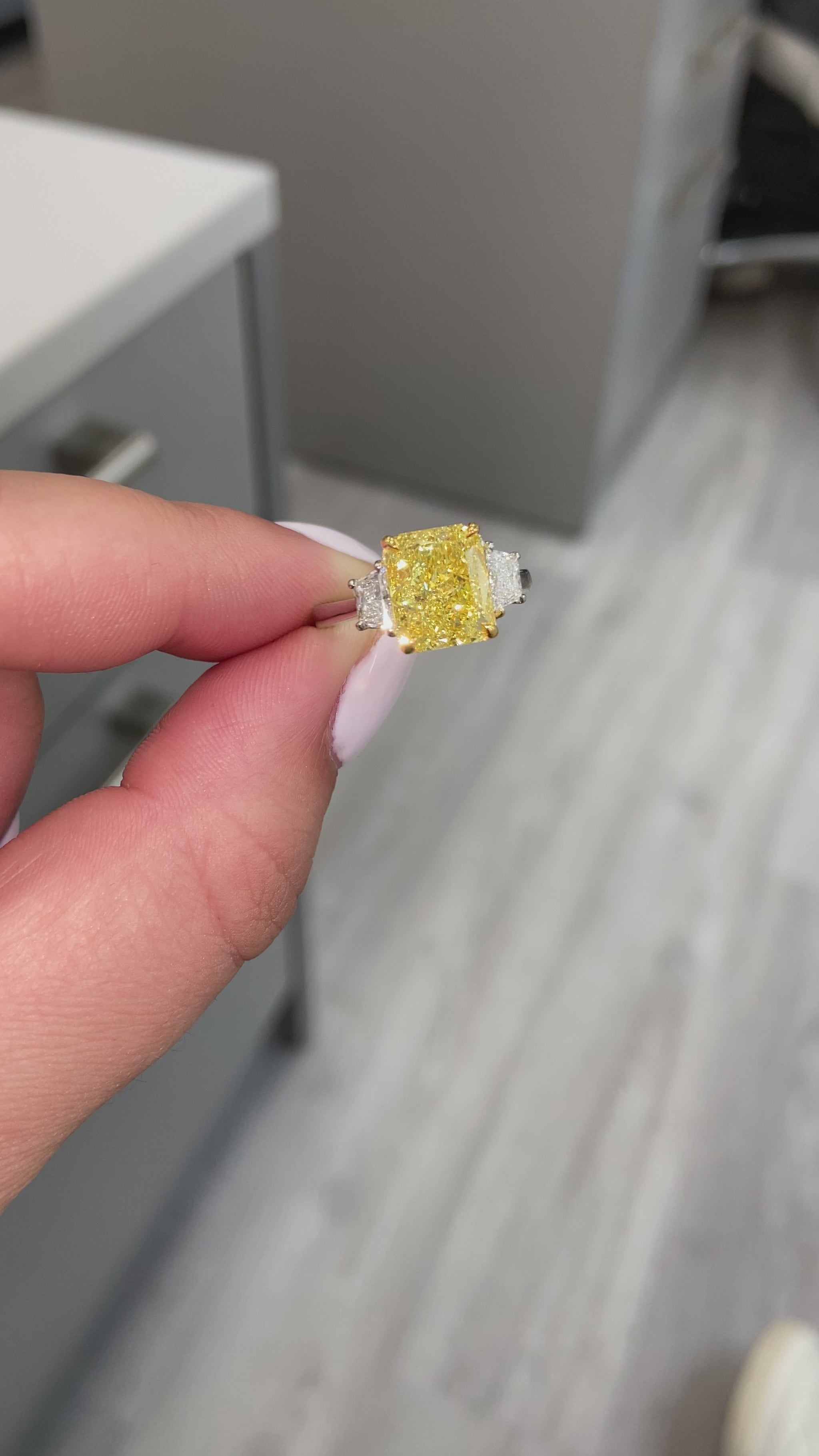 Fancy intense yellow elongated radiant diamond ring. Fancy intense yellow long radiant. Fancy intense yellow rectangular radiant