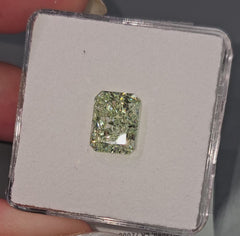 GIA certified fancy intense yellowish green radiant diamond with a vibrant hue and VS2 clarity.