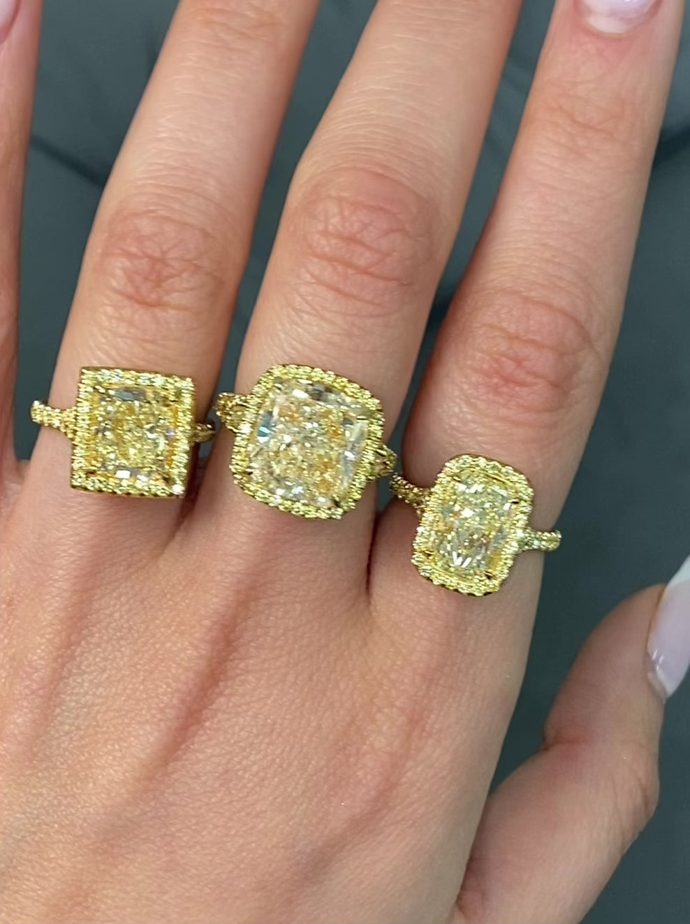 GIA certified light yellow elongated cushion cut diamond ring with canary yellow and golden yellow diamonds, SI1 clarity.