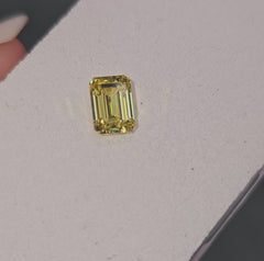 Radiant yellow emerald cut diamond, GIA certified.