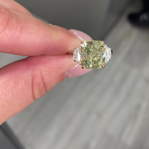 Fancy Yellow-Green cushion cut diamond engagement ring with VS2 clarity and a unique hue.