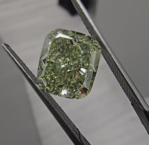 Yellowish green cushion cut diamond, GIA certified.