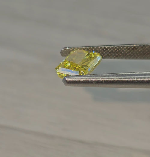 Fancy vivid yellow natural diamond, elongated radiant cut diamond