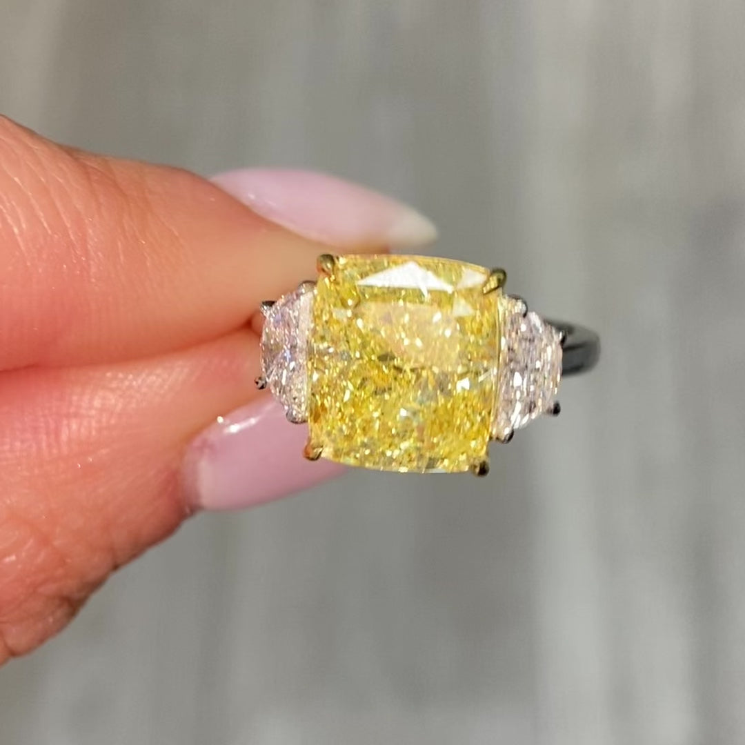 GIA certified Fancy Yellow Cushion Diamond Engagement Ring with VS2 clarity and excellent cutting.