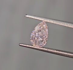 Fancy pink pear shaped diamond with subtle color, GIA certified.