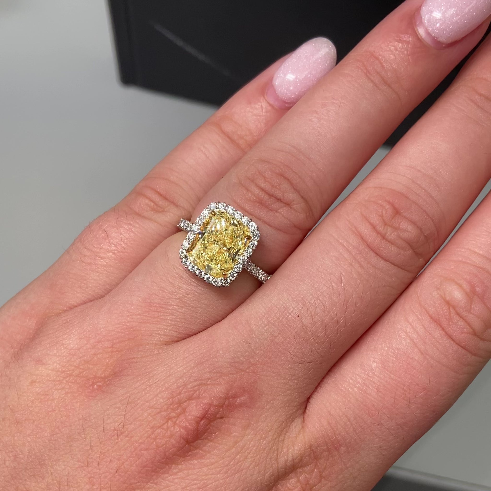 3ct Fancy Yellow Cushion Halo Diamond Ring with a canary yellow diamond