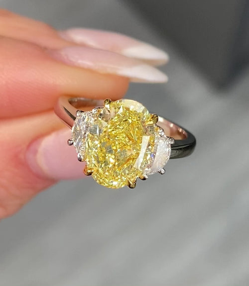 Stunning yellow oval cut diamond engagement ring featuring SI1 clarity.