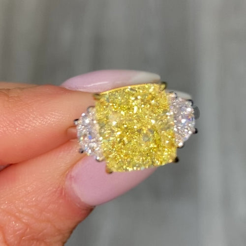 GIA certified Fancy Yellow Cushion Diamond Engagement Ring with VS2 clarity and excellent cutting.