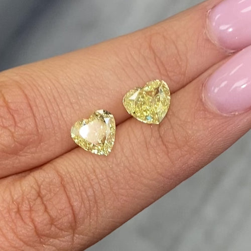 Unique matched pair yellow heart shaped diamonds, GIA certified.