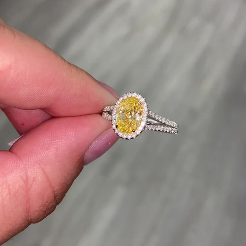 Fancy intense yellow oval diamond ring