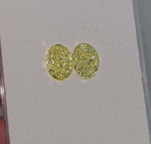 GIA certified matched pair of 2 natural yellow oval diamonds.