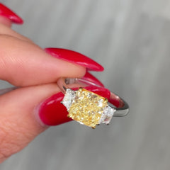 2.28 Carat Center Fancy Light Yellow Cushion Cut Diamond  SI2 Clarity 0.32 Carats of E Color Trapezoids GIA Certified Diamond  Crafted in Platinum and 18k Yellow Gold Handmade in NYC