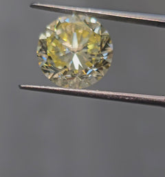 Unique elongated yellow natural handmade diamond.