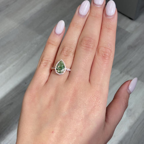 GIA Certified green diamond pear shape ring. Green diamond jewelry. JLO green diamond