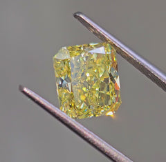 Elongated natural canary yellow diamond, GIA certified, with sparkling facets.