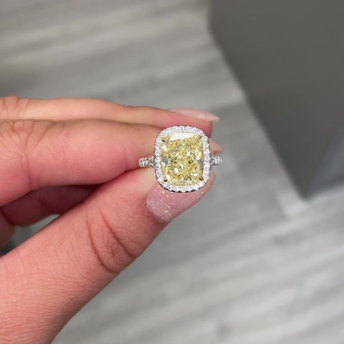 4.73 Carat Center Diamond GIA Light Yellow VS2 Clarity  Cushion Cut Diamond  0.52 Carats of White Rounds  Set in Platinum and 18k Gold  Split Shank band  Handmade in NYC GIA Certified Diamond 