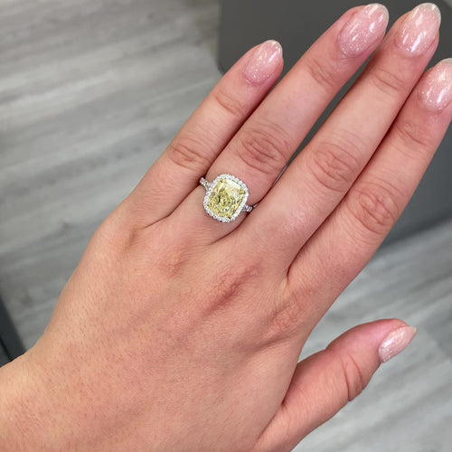 4.73 Carat Center Diamond GIA Light Yellow VS2 Clarity  Cushion Cut Diamond  0.52 Carats of White Rounds  Set in Platinum and 18k Gold  Split Shank band  Handmade in NYC GIA Certified Diamond 