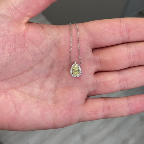 Simple yet elegant yellow diamond pedant that would compliment anyones collection. 1 Carat carat natural fancy light yellow pear shape diamond. Set in 18 karat gold with classic halo. Handmade in New York City.