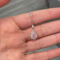 Pink diamond necklace with a pear-shaped pink diamond and double halo on a delicate chain with a VS2 clarity.