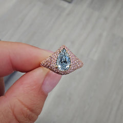 GIA light blue pear shape diamond ring set with natural pink diamonds