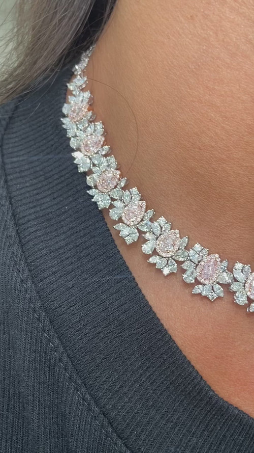 GIA certified light pink pear shape diamonds with mixed white diamonds in a stunning necklace.