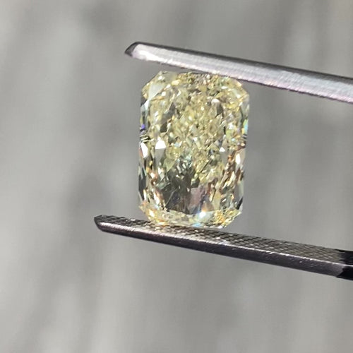 Light yellow radiant cut diamond with VS1 clarity, excellent cut, GIA certified.