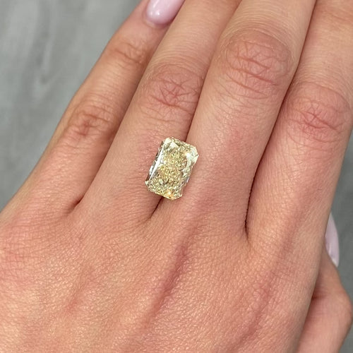 Light yellow radiant cut diamond with VS1 clarity, excellent cut, GIA certified.