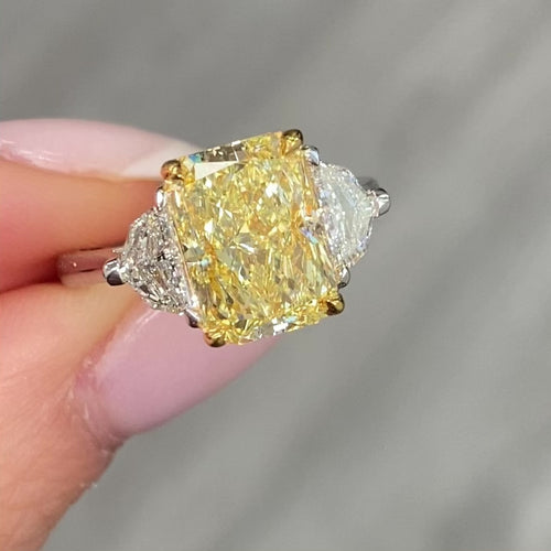 A unique GIA certified ring with Elongated fancy yellow diamond ring.