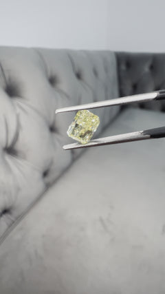 Elongated fancy intense yellow diamond radiant cut. Long yellow diamond radiant cut. Long radiant diamond.