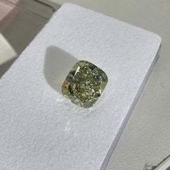 Yellowish green cushion cut diamond, GIA certified.