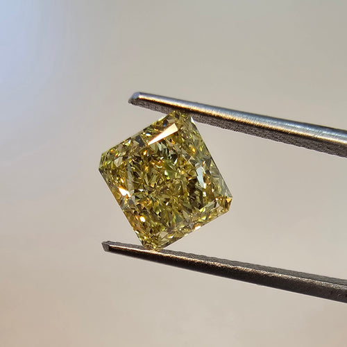 A 1.76 Carat GIA Certified Fancy Intense Yellow radiant cut diamond with eye clean SI1 clarity. Featuring all around Very Good cutting and no fluorescence. 