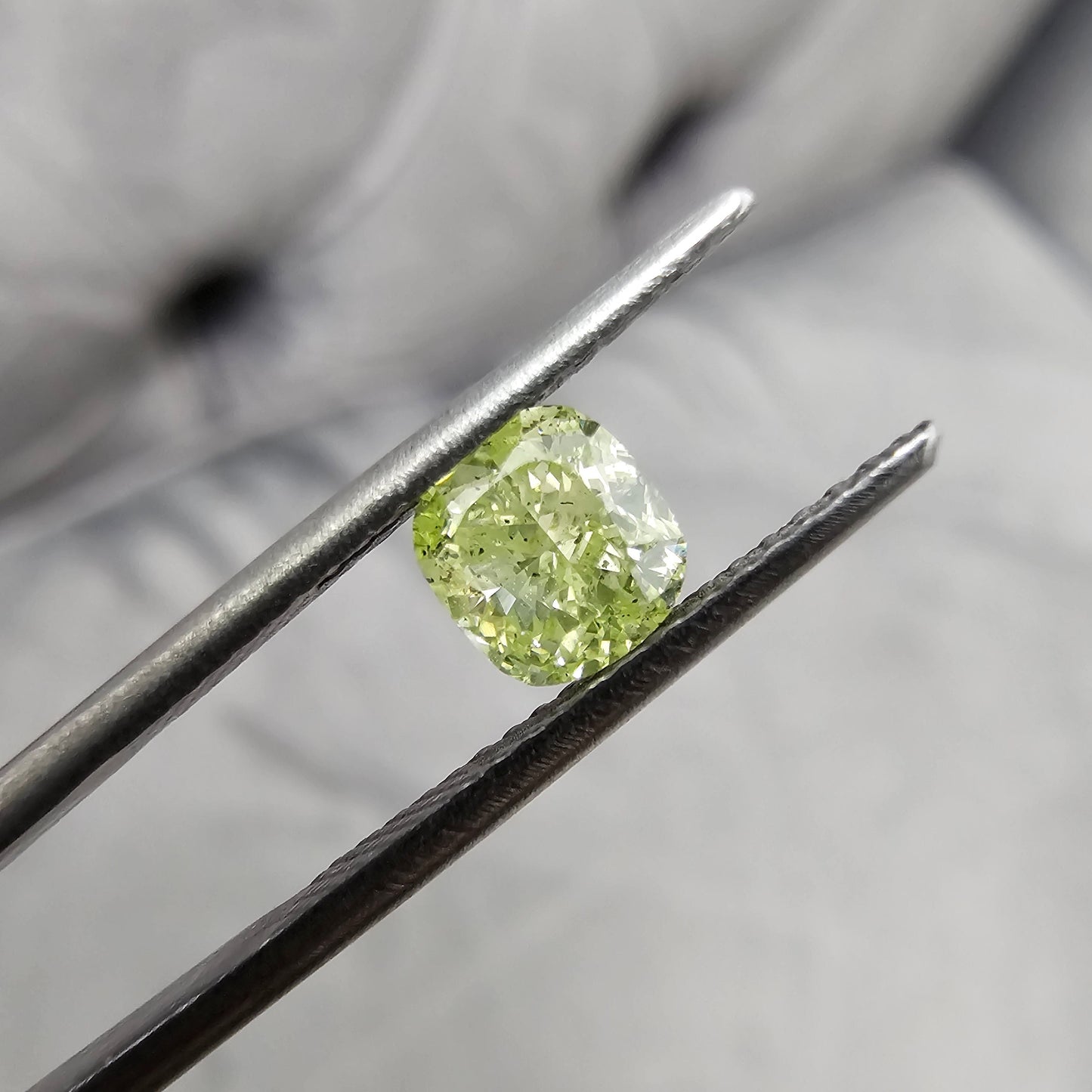 1.03 Carat  Fancy Intense Yellow-Green Color An exceptional LIME green color  Strong Green Fluorescence - Ultra Rare! Cushion Cut Diamond  I1 Clarity - Eye Clean GIA Certified Diamond