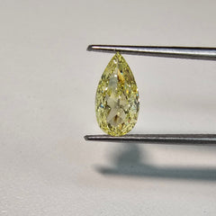 GIA certified fancy Intense Yellow pear-shaped diamond with SI1 clarity and vibrant brilliance.