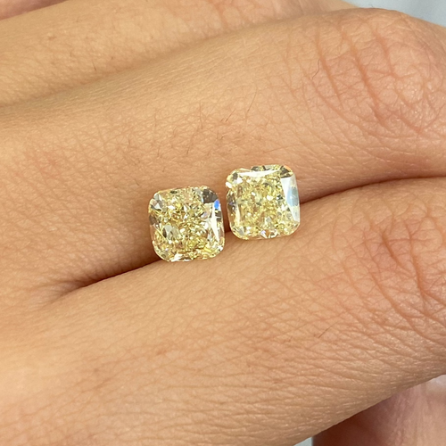 matched pair of natural fancy light yellow cushion cut diamonds 