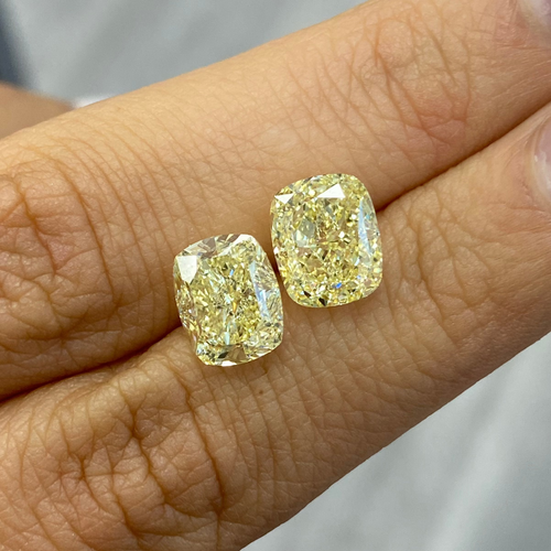 Unique matched pair of natural light yellow cushion cut diamonds, fine color diamond. 