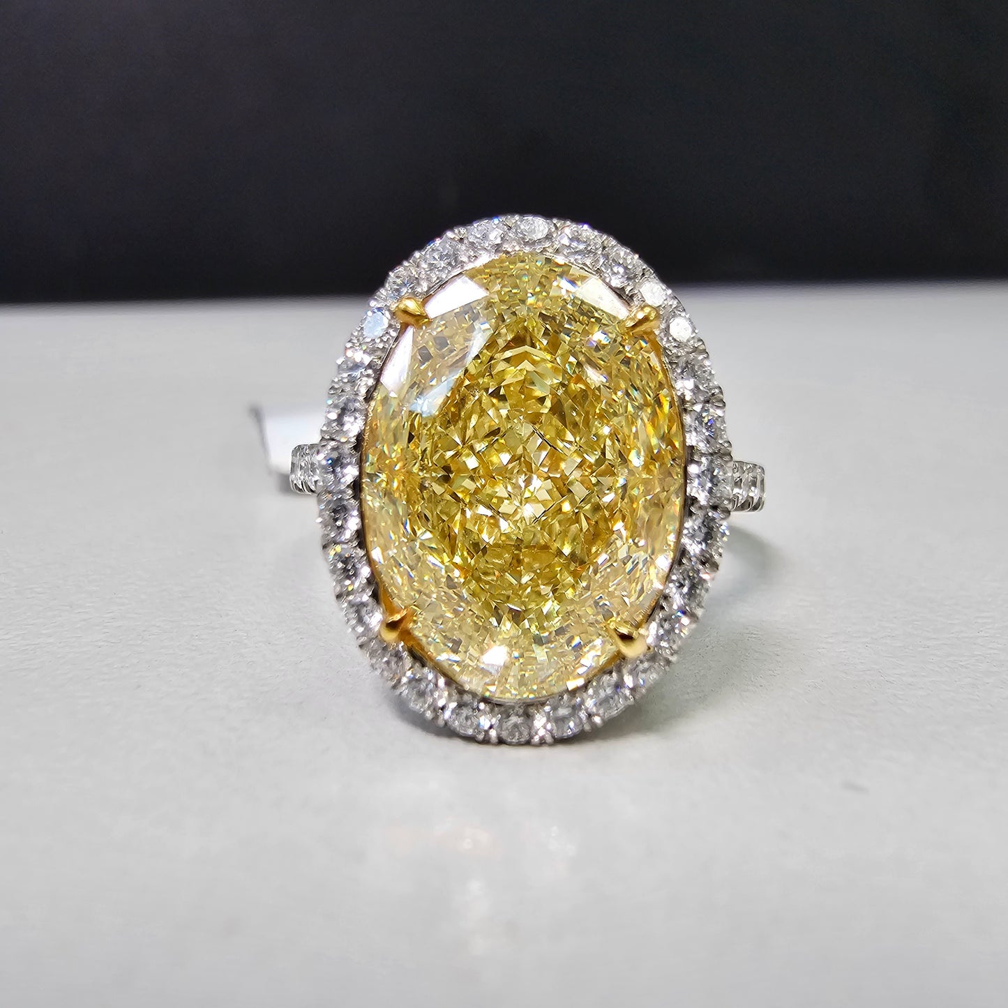 6 carat fancy light yellow diamond oval halo ring, yellow diamond engagement ring