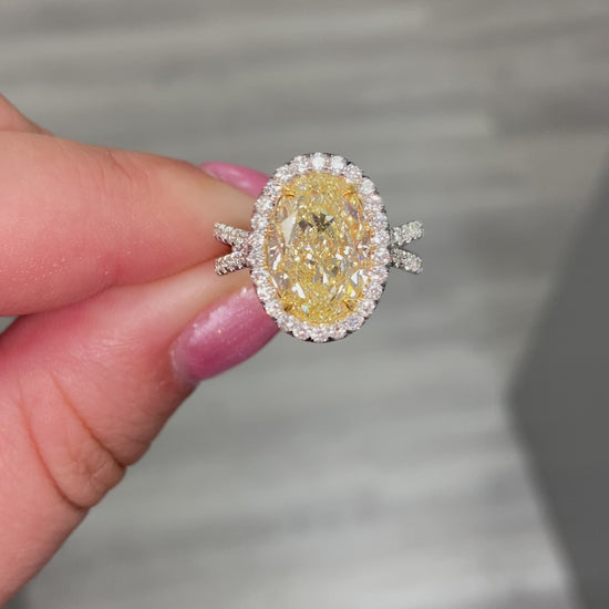 Yellow diamond oval ring. Oval diamond engagement ring. canary yellow oval. halo diamond ring. oval diamond ring