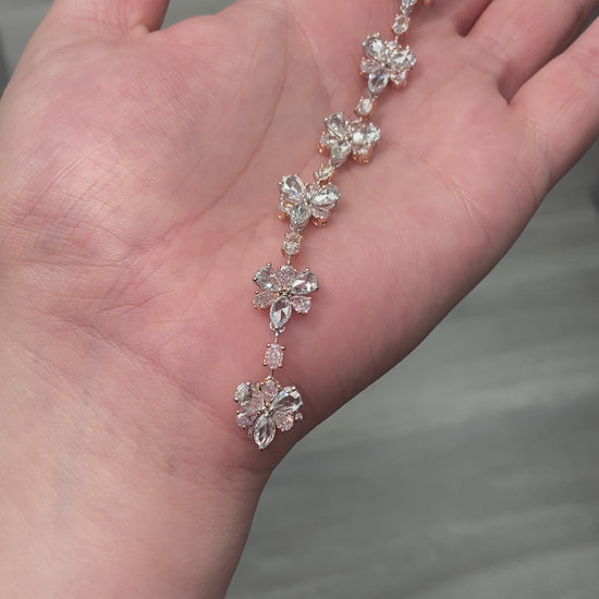 rare colors. pink diamond bracelet. pink floral bracelet. pink pear shape diamond. pink and white diamond bracelet. Natural pink diamond jewelry.