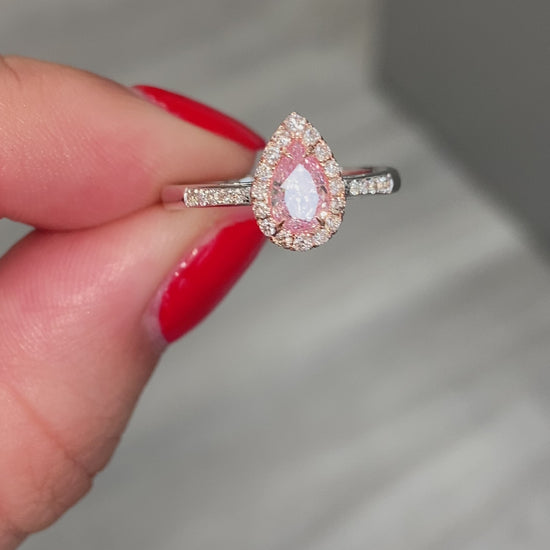  Pink diamond ring. pink diamond engagement ring. light pink diamonds. light pink pear shape. diamond ring. Pear diamond ring.