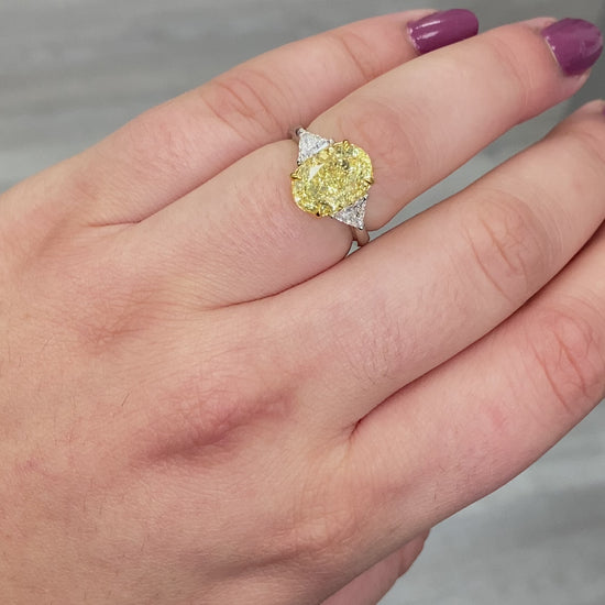 Fancy yellow diamond ring. Yellow diamond engagement ring. Canary diamond ring. Oval engagement ring. Fancy yellow diamond. Yellow diamond 3 stone ring. Fancy yellow. Oval diamond ring 